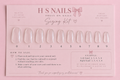 Rose French Tip press-on nails in a clear storage box